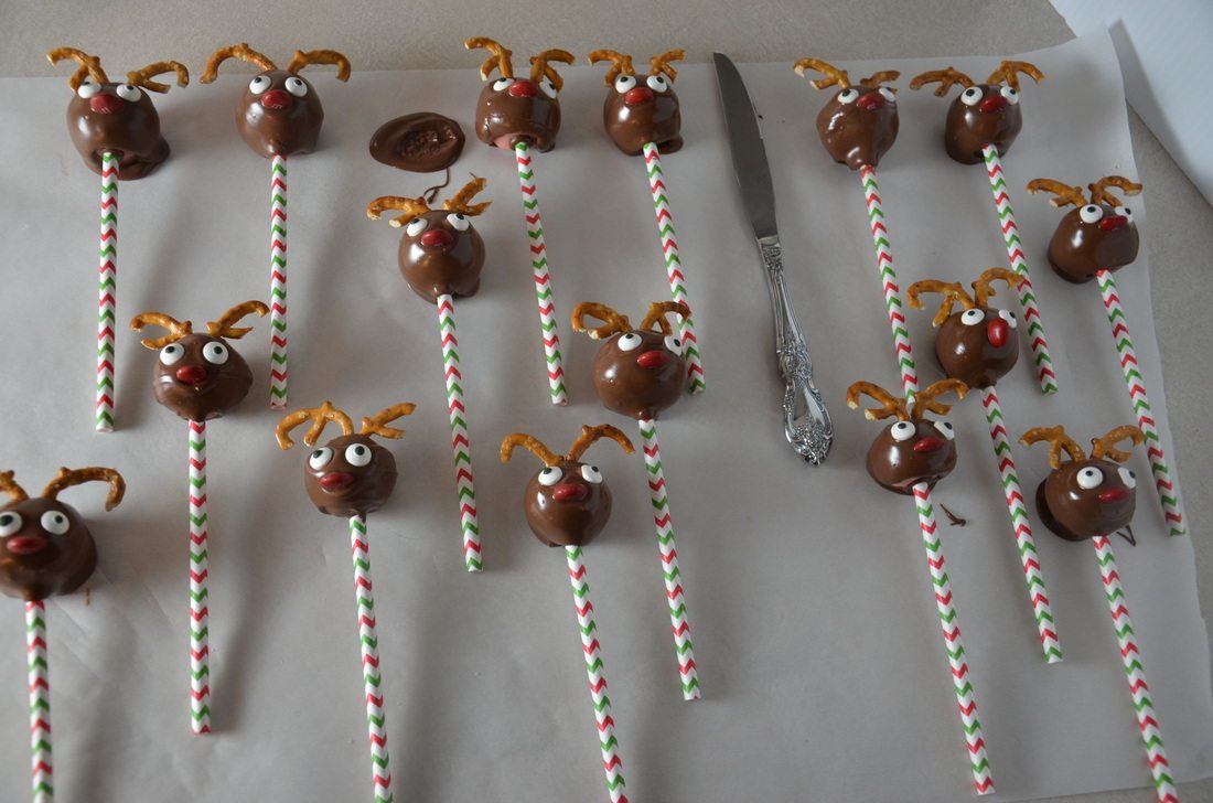 Reindeer cake pops_grouped Dipped, decorating, and drying. Let dry completely before moving.
