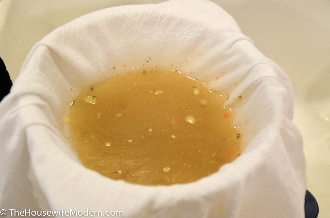 Homemade Chicken & Vegetable Broth_straining3 After a little bit, you may have to “wiggle” the cloth a little bit to get it to finish straining.