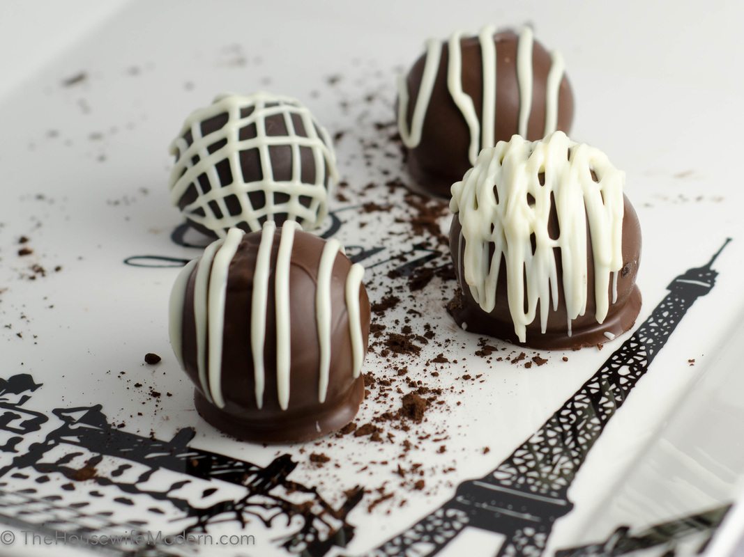 Devil's Food Cake Bites Luscious Devil's Food Cake in a (large) bite...covered in chocolate. Multiple ways to pipe secondary chocolate. Criss-cross, single line, lines on top of each other, etc.