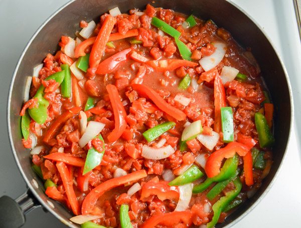 Add tomatoes and oregano. Cook 3 minutes. Stir in hot sauce.