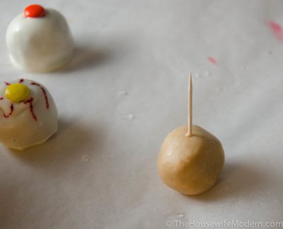 Stab chilled buckeye with a toothpick, about halfway through.