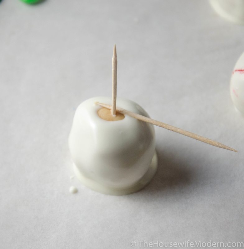 Place onto waxed paper. Use a second toothpick for pressure if the buckeye doesn't easily "drop off" onto parchment paper.