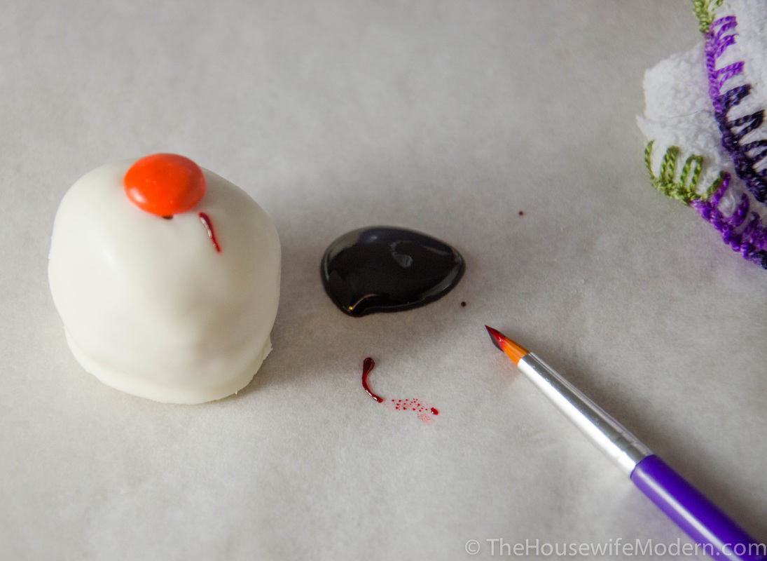 Using fine toothbrush, drizzle red dye onto balls and make veins. A “brush” motion actually leaves it too thin (it turns pink), drizzling works better. Doesn’t need to be perfectly neat.
