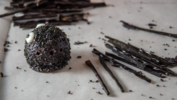 Spiders_prep9 No rush here. Use a toothpick to CAREFULLY make holes for legs. Dig out space so licorice will go in easily.