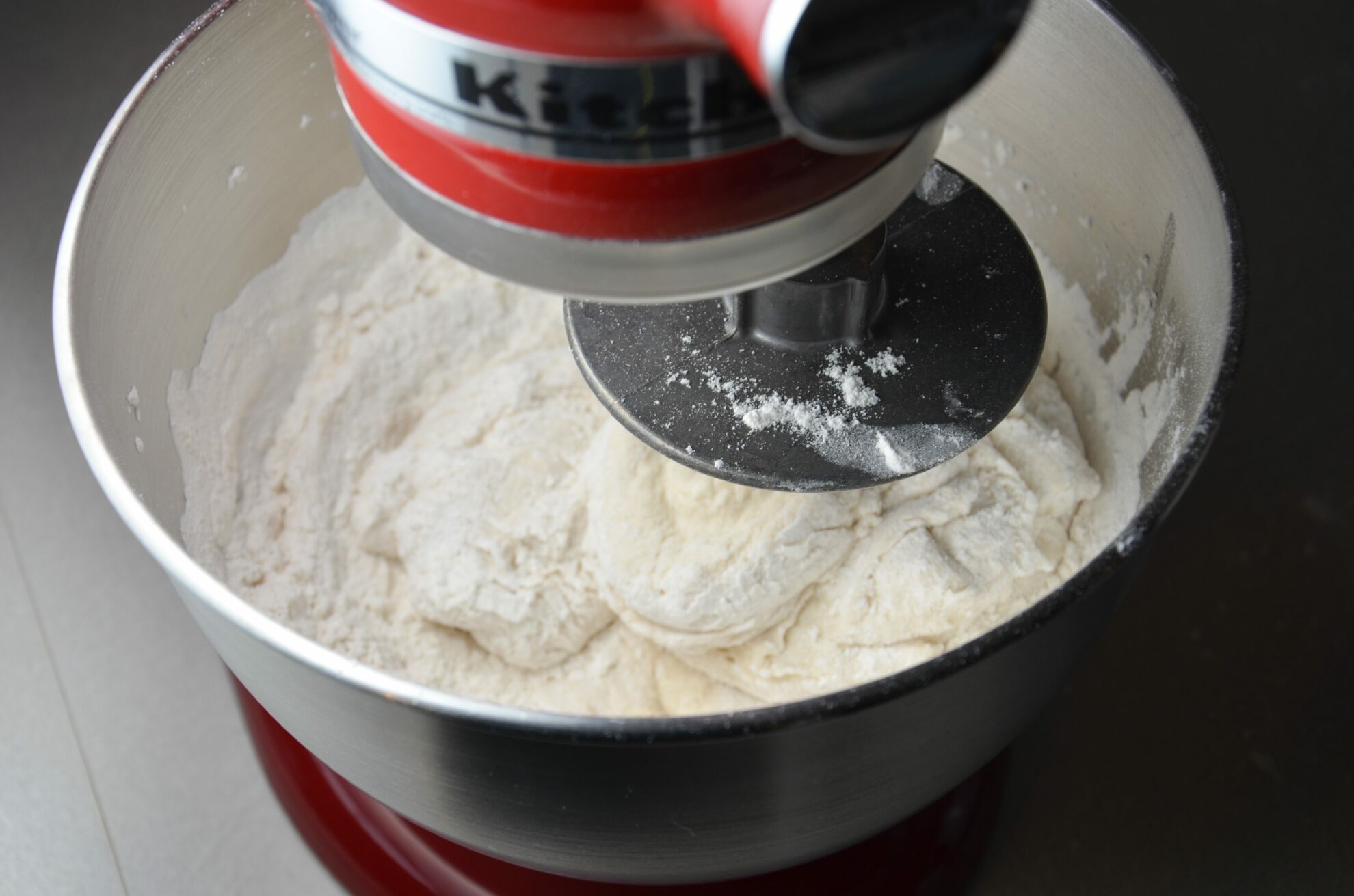 Dough will become thicker and stick to dough hook. (Note the texture of the dough).