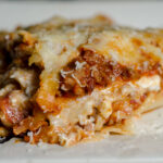 Easy, classic meat lasagna. Step-by-step pictures and instructions, printable recipe. Two meats, three cheeses, and delicious.