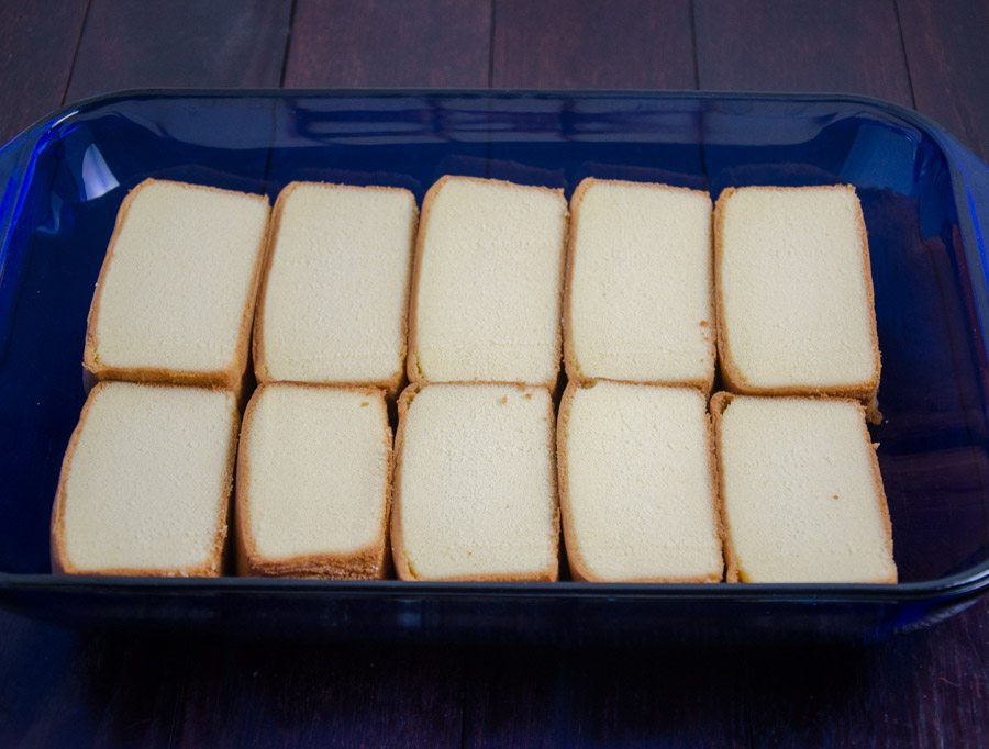Layer sliced pound cake in bottom of 9" x 13" baking dish.