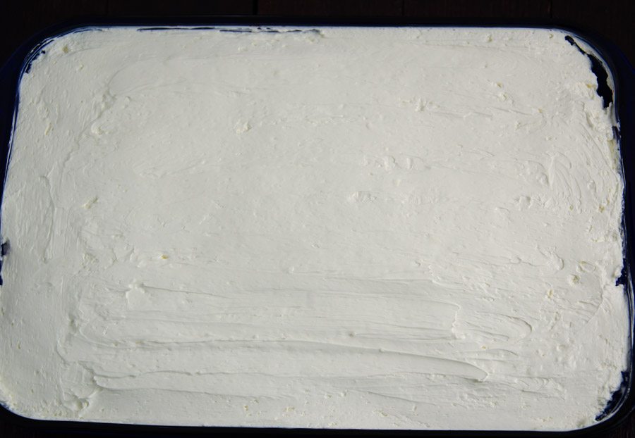 Spread cream cheese/Cool Whip topping over chilled pound cake/jell-o. Smooth. Then decorate with strawberries & blueberries.