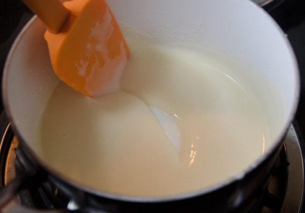 LR_White Chicken Enchiladas_prep-10 Continue to add broth, mixing very well before adding next batch. Example of how thick it will be during middle of adding.