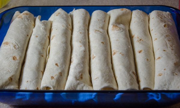 LR_White Chicken Enchiladas_prep-16 Roll and place in 9” x 13” baking dish.