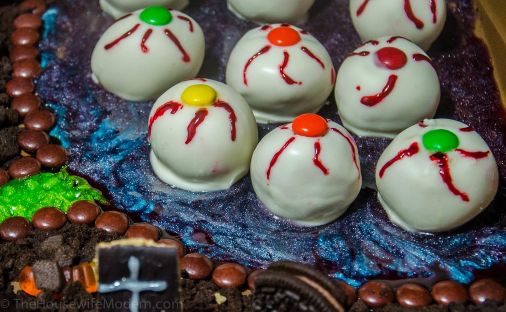 Irresistible Halloween Buckeyes- classic buckeyes dipped in white chocolate and decorated just for Halloween. Creepy…but delicious.