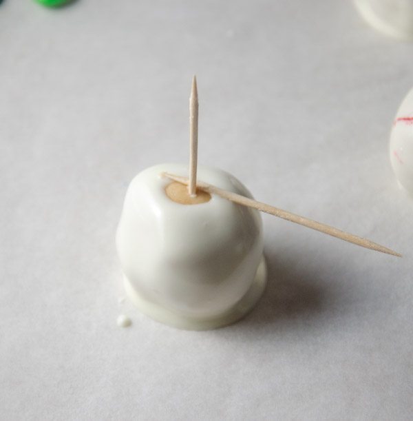Place onto waxed paper. Use a second toothpick for pressure if the buckeye doesn't easily "drop off" onto parchment paper.