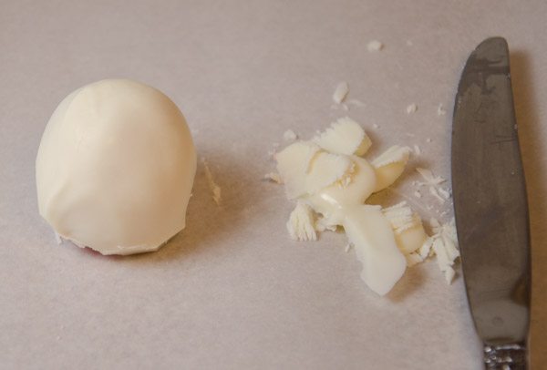 LR_Mummies_prep12 After set, trim off any excess chocolate around the base. Use finger to smooth any rough edges.