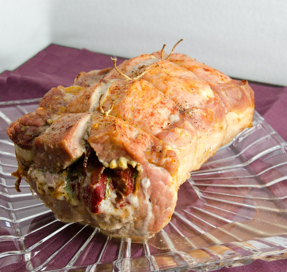 Tuscan-Style Pork Loin: tender, moist, & flavorful. Pork stuffed with cream cheese, bacon, pesto, roasted peppers, and more.