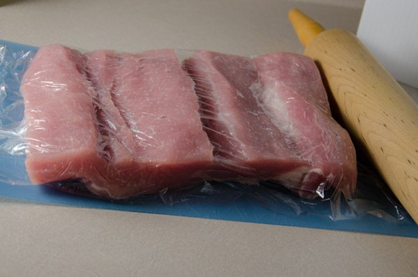 Tuscan-Style Pork Loin: tender, moist, & flavorful. Pork stuffed with cream cheese, bacon, pesto, roasted peppers, and more.