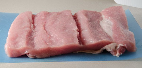 Tuscan-Style Pork Loin: tender, moist, & flavorful. Pork stuffed with cream cheese, bacon, pesto, roasted peppers, and more.