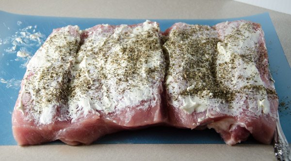 Tuscan-Style Pork Loin: tender, moist, & flavorful. Pork stuffed with cream cheese, bacon, pesto, roasted peppers, and more.