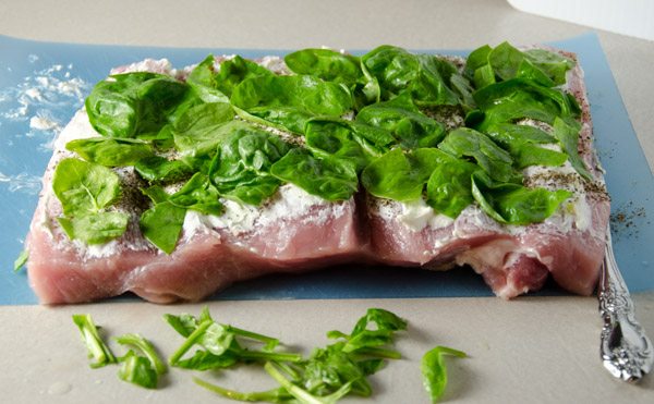 Tuscan-Style Pork Loin: tender, moist, & flavorful. Pork stuffed with cream cheese, bacon, pesto, roasted peppers, and more.