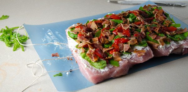 Tuscan-Style Pork Loin: tender, moist, & flavorful. Pork stuffed with cream cheese, bacon, pesto, roasted peppers, and more.