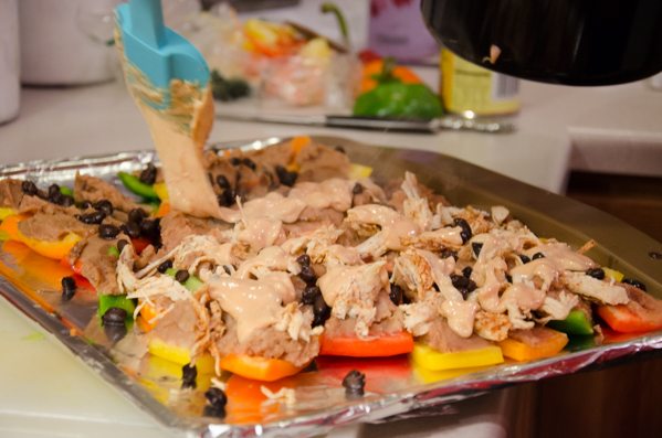 Drizzling the cheese. I confess: almost half of the calories are cheese alone. Probably why they taste so good.