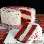 Layered Red Velvet and White Chocolate Cheesecake with White Chocolate Cream Cheese Frosting (aka: Red Velvet Cheesecake). The most delicious dessert you will ever make. #redvelvet #cheesecake #chocolate #whitechocolate #desserts #sweets #redvelvetcheesecake #valentines