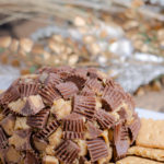 Reese's Peanut Butter Cup Cheese Ball. This to-die-for dessert (or appetizer!) is easy to make and absolutely delicious. I always catch at least one guest eating it with a spoon instead of on the graham crackers.
