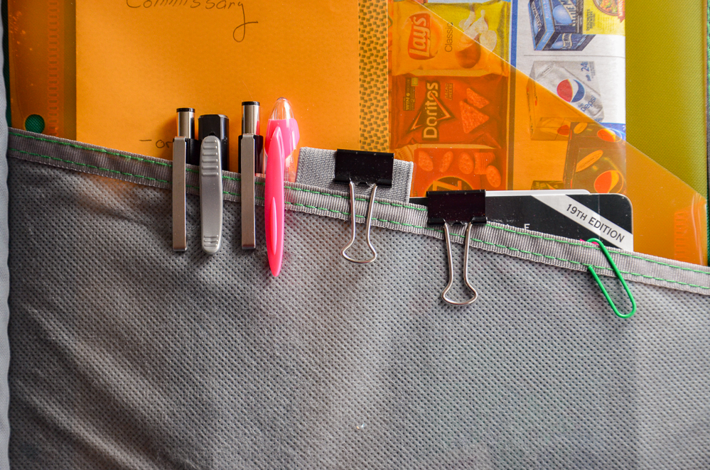 Inside flap: I keep pen, pencil, highlighter, and any miscellaneous coupon books (such as local fundraiser books).