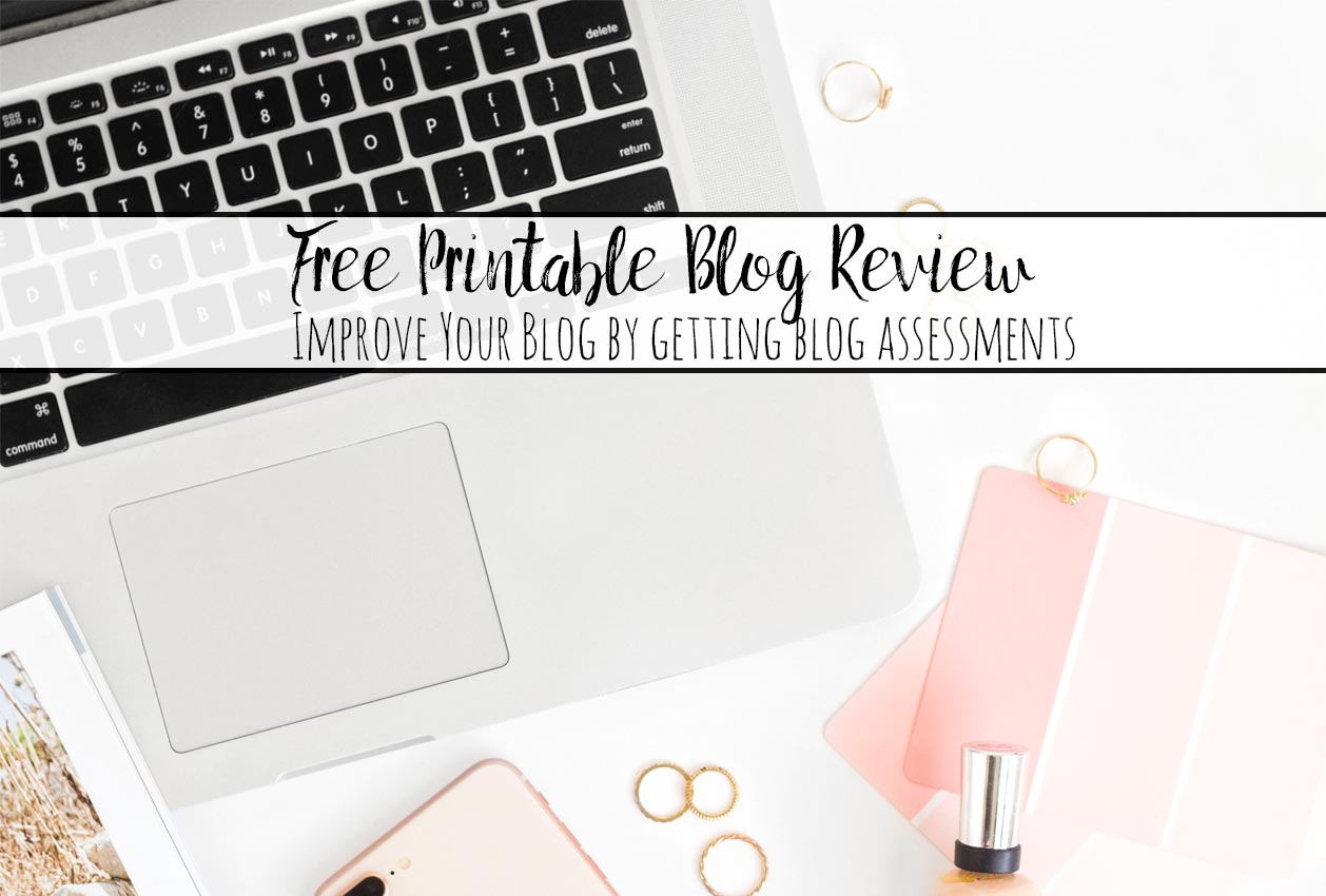 Featured image for free printable blog review. Pinkish computer, notepads, with text overlay.