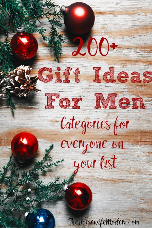 Pin image for 200+ gift ideas for men. Wood background, red ornaments, and evergreen with text overlay.