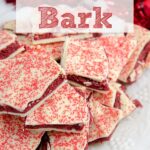 Pin image for red velvet bark. Close-up of bark piled on white plate with red tinsel in background with text overlay.