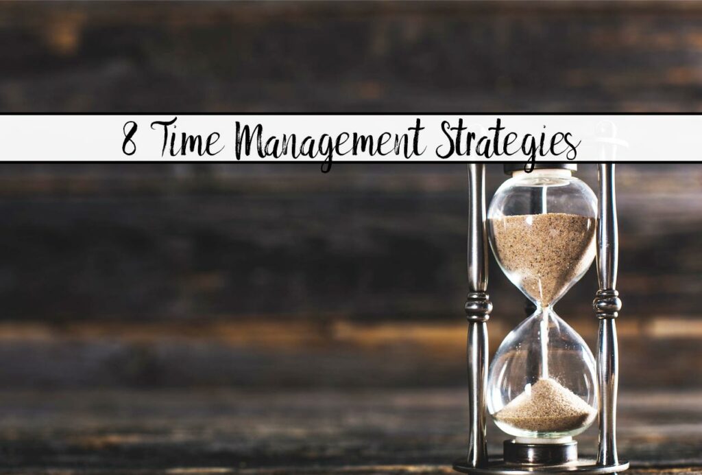 Featured image for 8 time management strategies. Hourglass with wood background and text overlay.