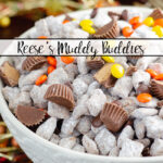 Featured image. Large white bowl of Reese's Muddy buddies on wood background with fall colored wire and beads.