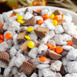 White bowl with Reese's muddy buddies close-up, vertical photo.