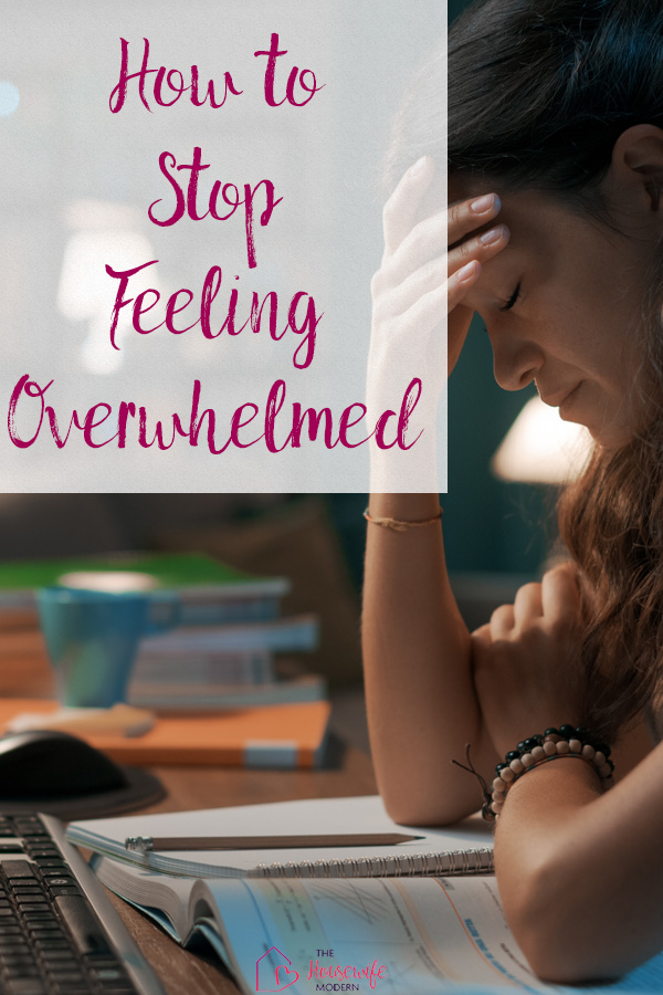 How to stop feeling overwhelmed pin image. Person with head on hand in front of computer.