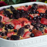 Triple berry baked oatmeal in white casserole dish