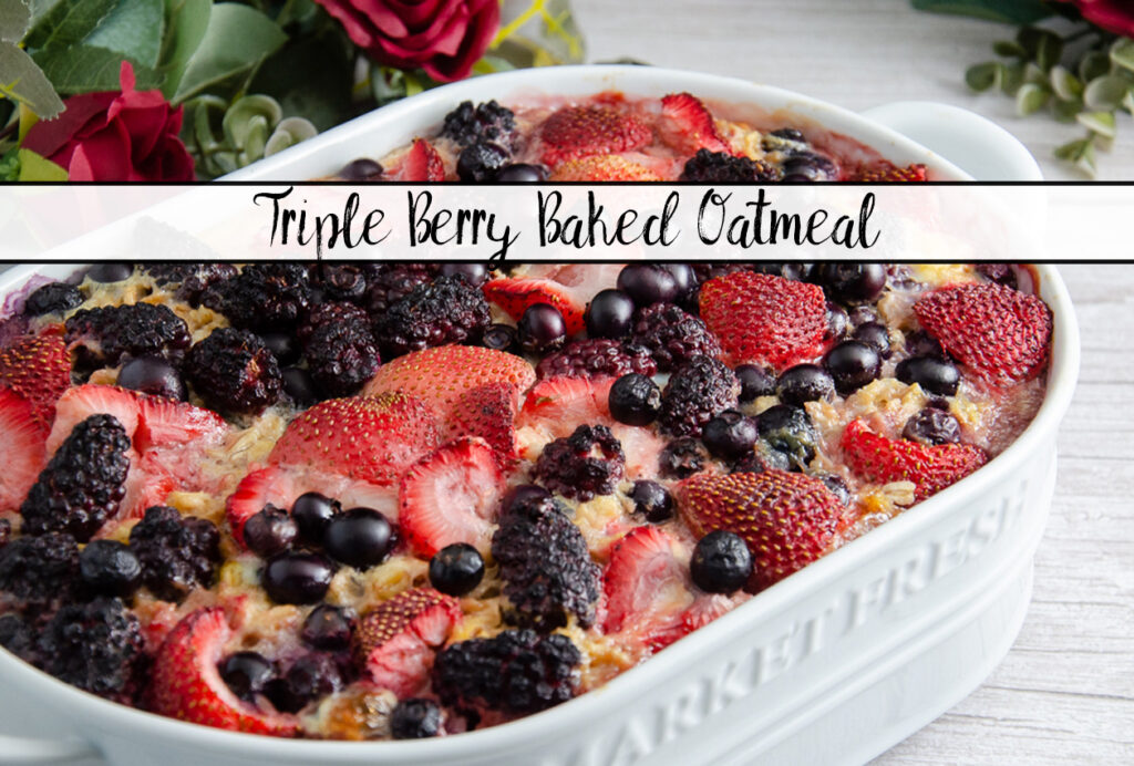 Featured image for triple berry baked oatmeal. Oatmeal in white casserole dish.