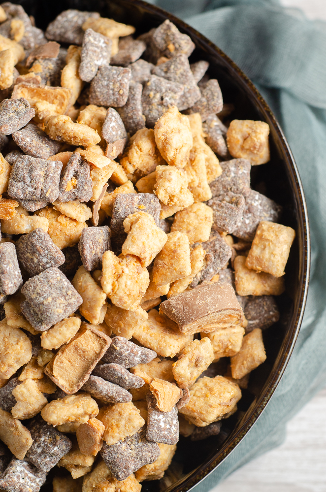 Close-up of Butterfinger muddy buddies. Overhead view with blue cheesecloth on side.