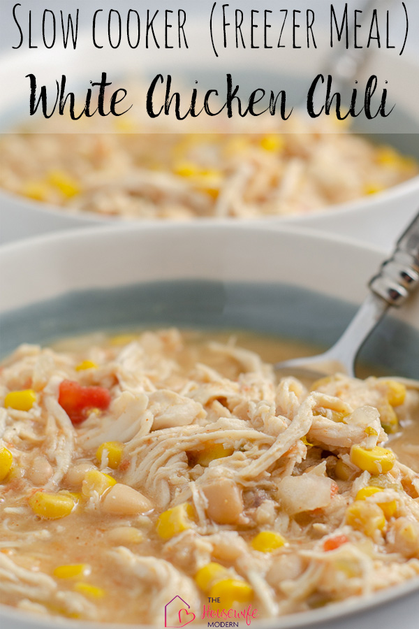 Pin image for slow cooker white chicken chili. Chili in white and light blue bowl with silver spoon. Text overlay.