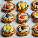 These easy fall pretzel kisses combine salty pretzels, chocolate Kisses, and Reese’s Pieces for a simple sweet-and-salty fall treat perfect for parties or Thanksgiving.