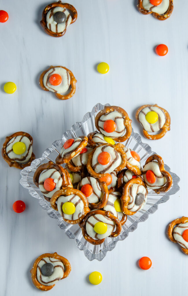 These easy fall pretzel kisses combine pretzels, striped Hershey's Kisses, and Reese’s Pieces for a colorful sweet-and-salty snack. These simple fall pretzel treats are perfect for autumn parties, after-school snacks, or Thanksgiving gatherings.